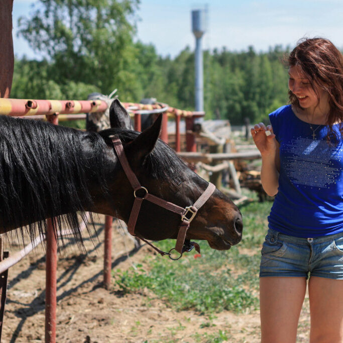 girl with horse at camp
