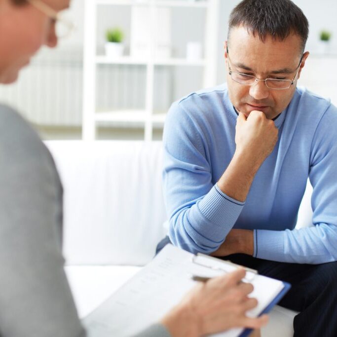 Man sharing problems with psychologist